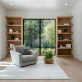 cozy home library nook with wooden shelves comfortable chair and natural light free photo 2